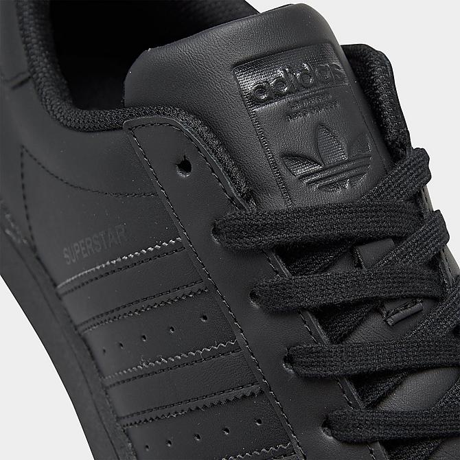 black adidas superstar top close up 