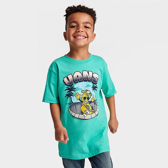 little boy in Vans graphic tee